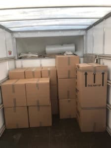 London movers moving packed furniture and belongings into storage